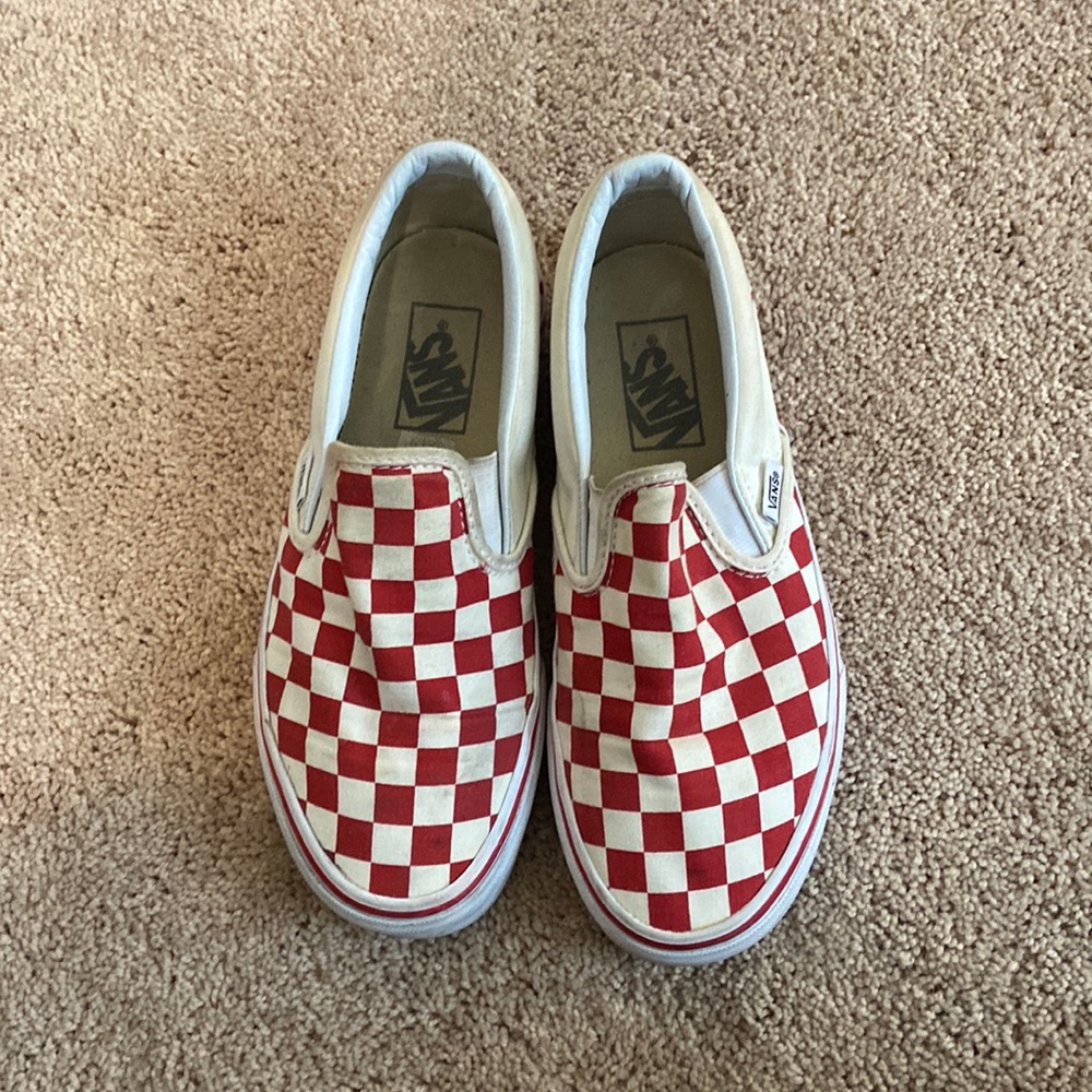 Red checkered slip on vans.